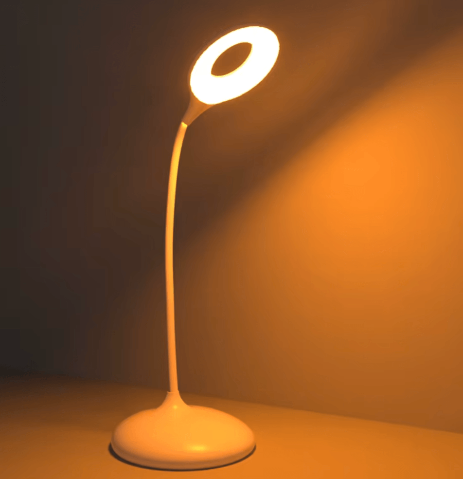 White flexible neck lamp emitting warm amber light designed for blue light free sleep environments.